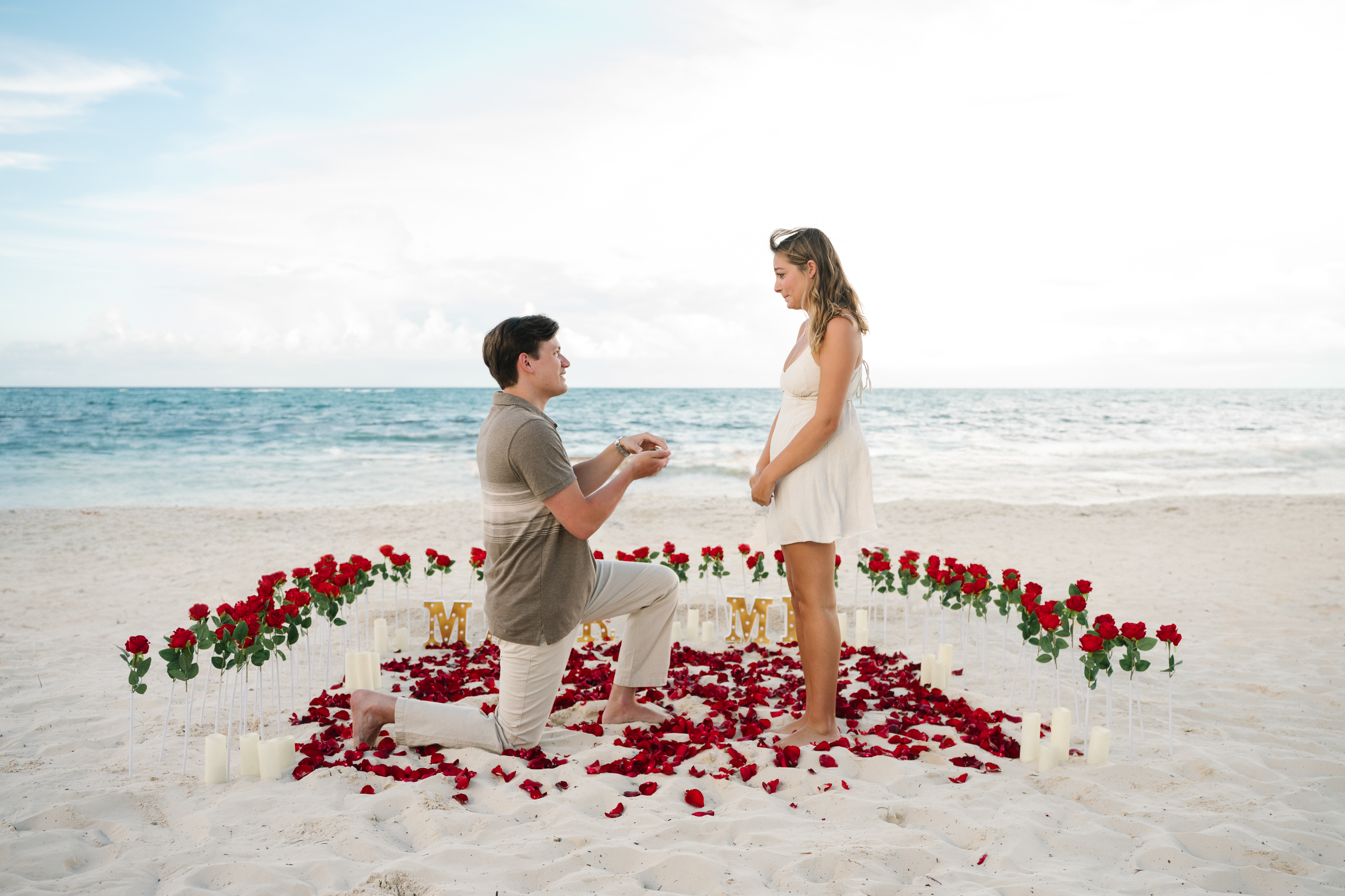 Jake proposing to Cassidy on the beach
